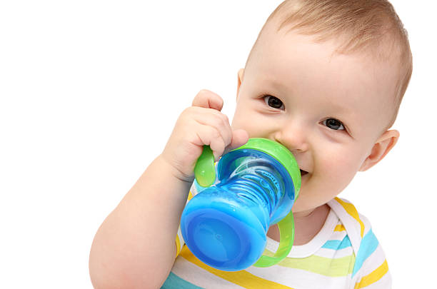 Toddler with sippy cup and milk